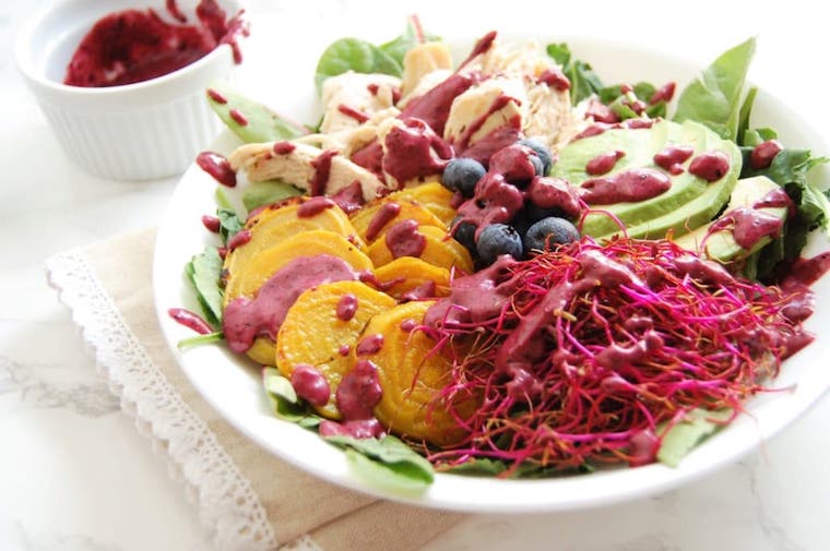 A white plate with a colourful salad.