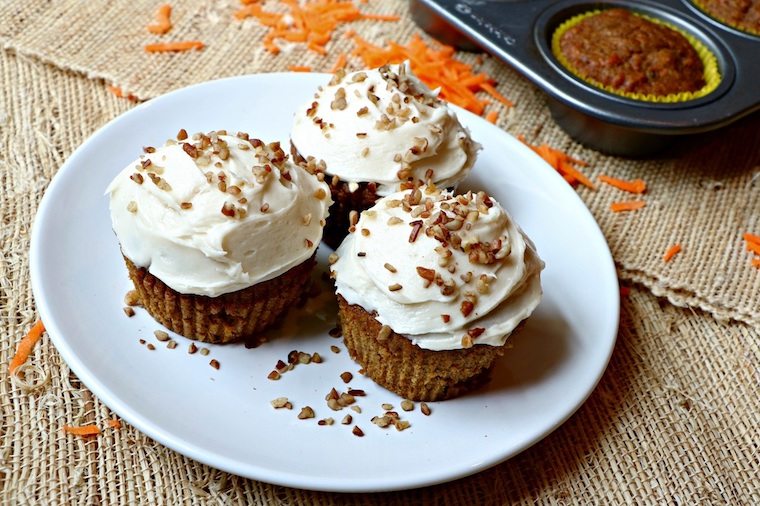 Three cupcakes on a white plate.