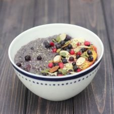A white bowl of slow cooker blueberry quinoa.