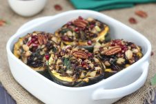 A white baking dish with four stuffed acorns inside.