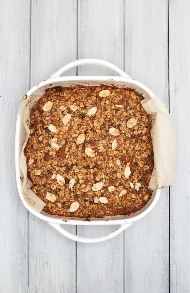 An overhead image of granola bars in a white baking dish.