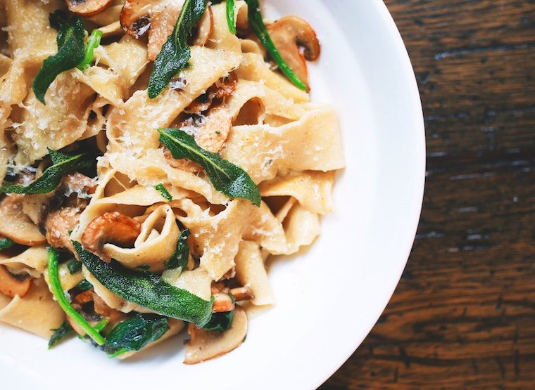 Birds eye view of pasta dish on a white plate.