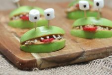 Close up of halloween apple alien smiles.