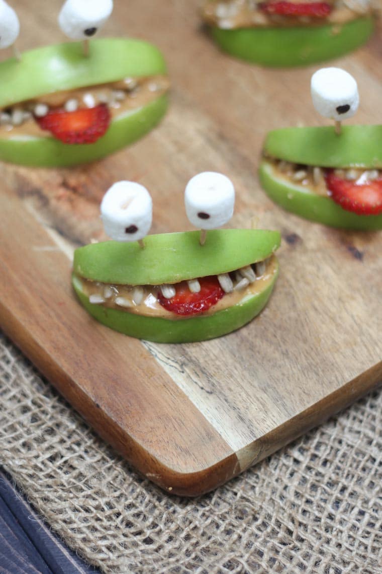 Close up of healthy halloween snacks for kids on a cutting board.