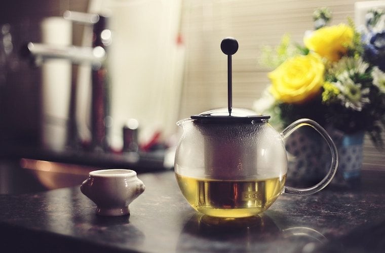 Tea pot brewing hot tea.
