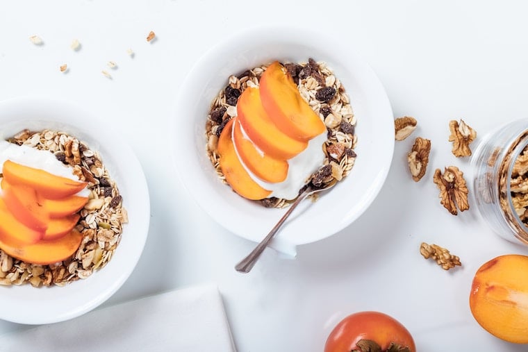 Bowls of yogurt, granola and peaches for quick heartburn relief after a holiday meal.
