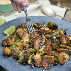 I'm spicing things up for Thanksgiving by serving up my tasty vegan and gluten free sweet chili roasted brussels sprouts side dish.