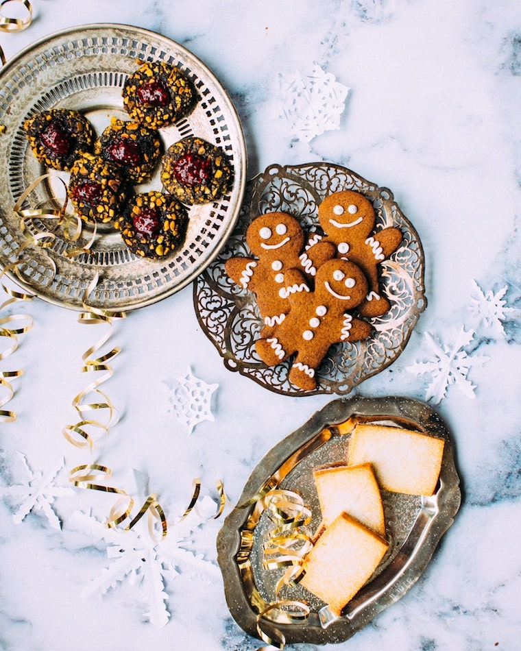 Plates of various holiday cookies. 