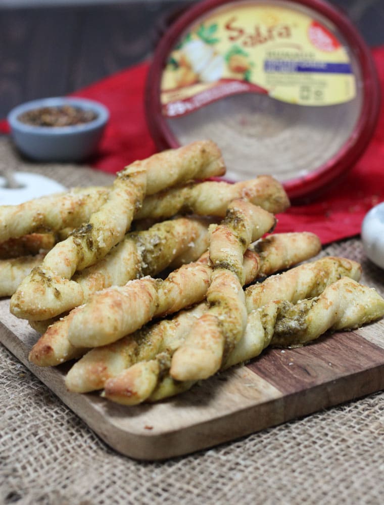 A platter with parmesan pesto pizza twists.