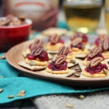 A close of a plate of sweet potato and cranberry mousse bites.