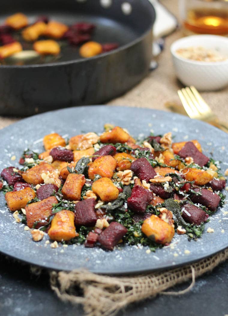 Beet gluten free gnocchi served on a platter.