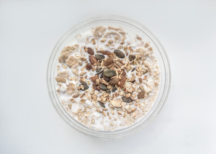 birds eye view of cereal and milk in a clear bowl