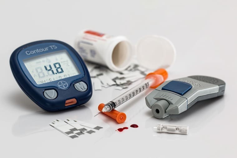 Image of diabetes testing kit referring to the question "Can you diet while pregnant?".