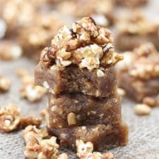 Three peanut butter blondies stacked on top of each other.