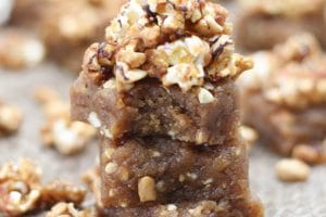 Three peanut butter blondies stacked on top of each other.