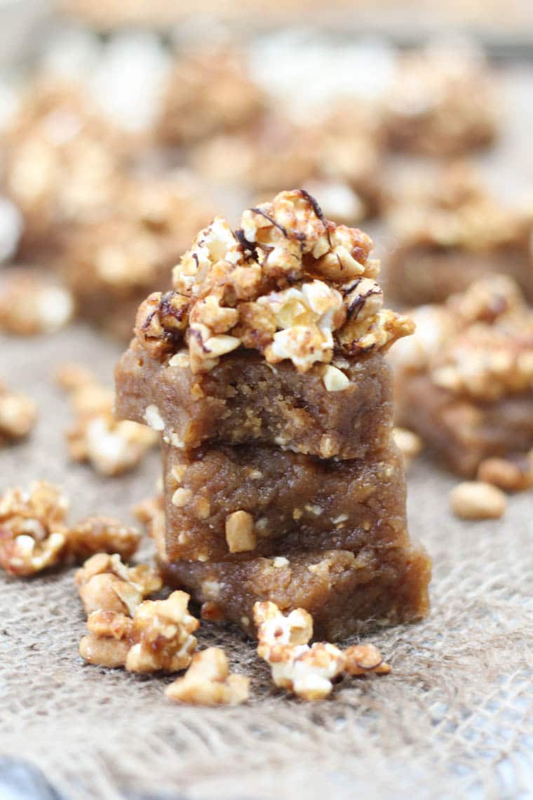 Three peanut butter blondies stacked on top of each other.