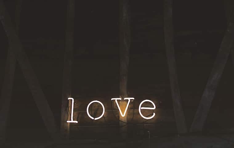 Neon light of the word \"love.\"