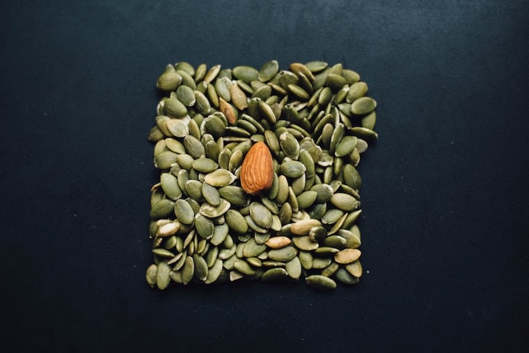 Pumpkin seeds and one almond.