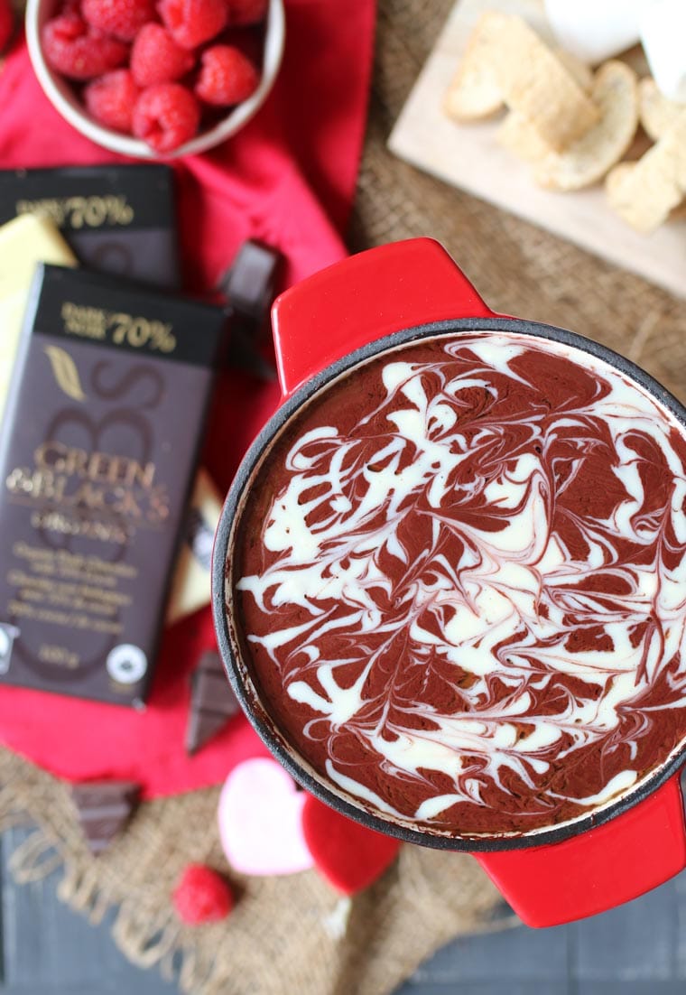 birds eye view of red velvet fondue with chocolate in background 