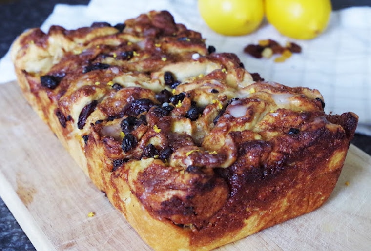 close up of vegan pull apart bread for easter with fresh lemons in the background