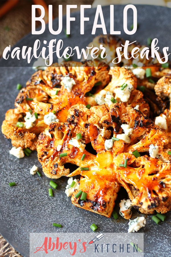 pinterest image of Buffalo cauliflower steaks topped with chives and blue cheese with text overlay