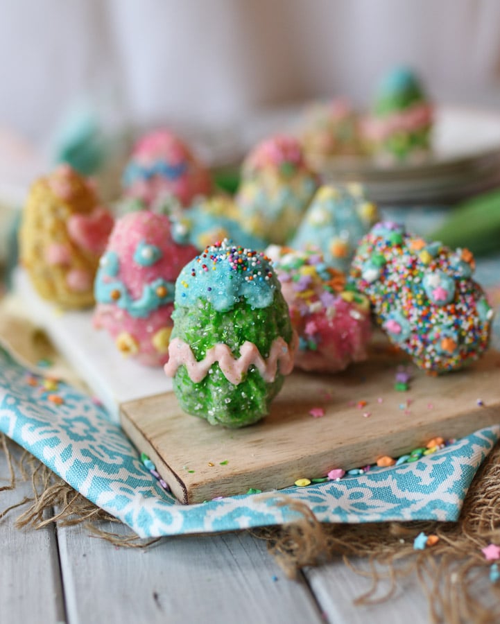 rice krispie easter eggs on a wooden plate 