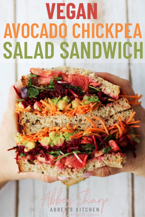 pinterest image of two hands holding chickpea sandwich with text overlay 