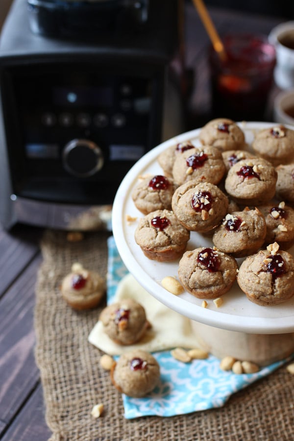 A plate of blender muffins with a vitamix in the background.