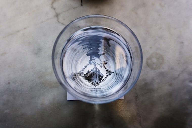 A glass of water.