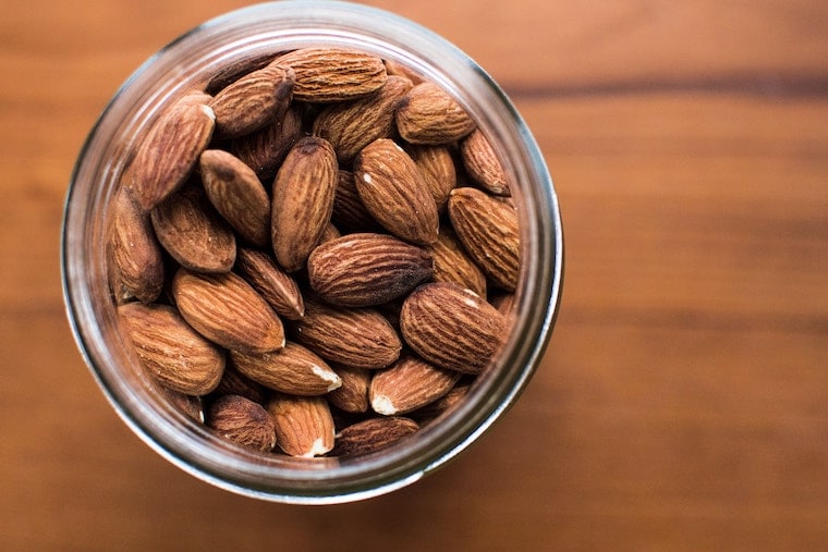 Overhead photo of a jar of almonds.