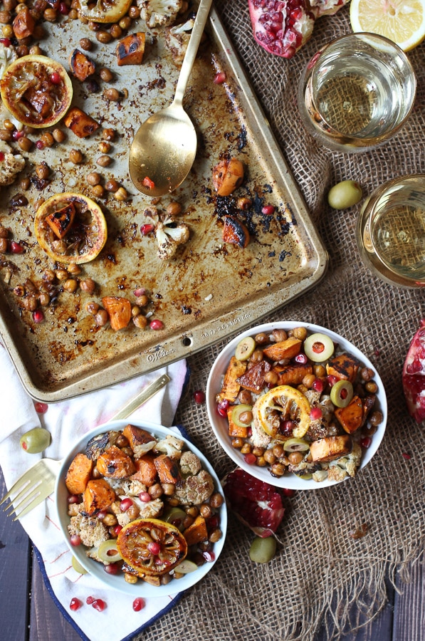 Chickpea and cauliflower sheet pan dinner served in two bowls.