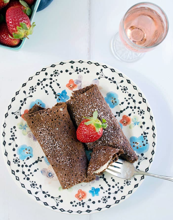 Chocolate blintzes on a plate. 