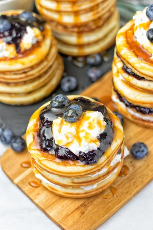 Ricotta blueberry pancakes topped with blueberries. 