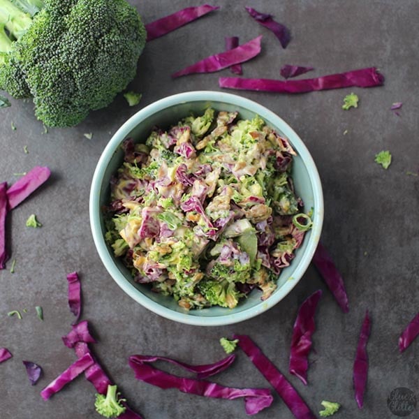 Broccoli slaw in a blue bowl. 