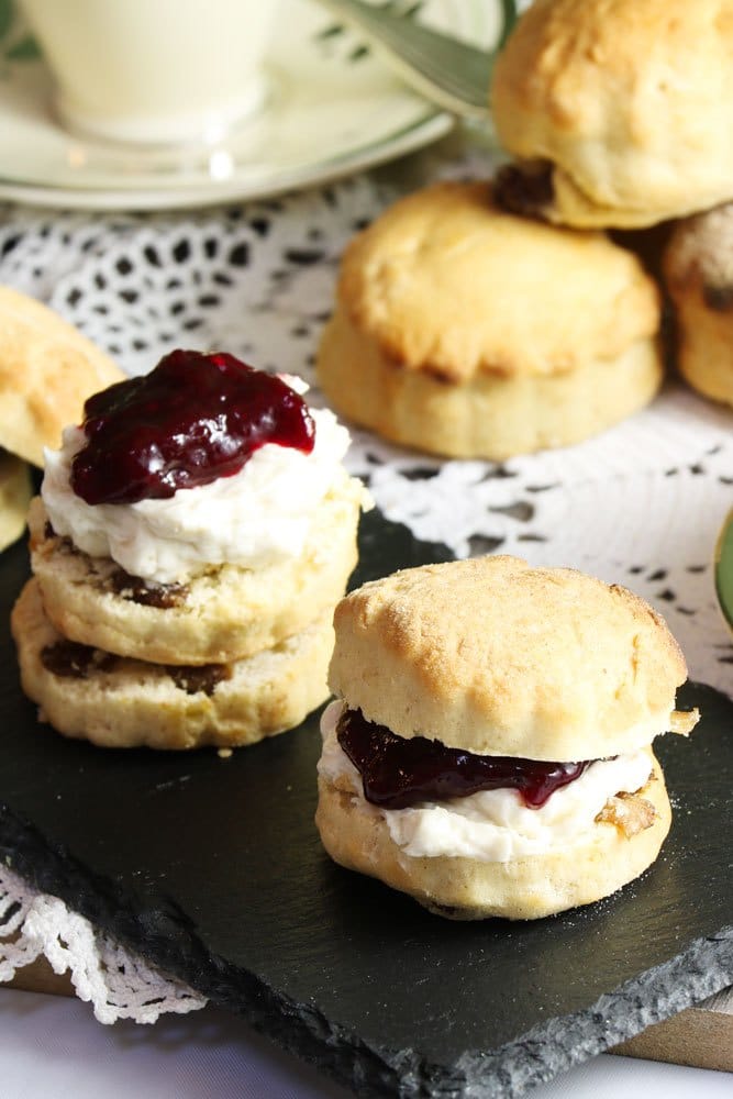 Vegan scones on a dark serving dish. 