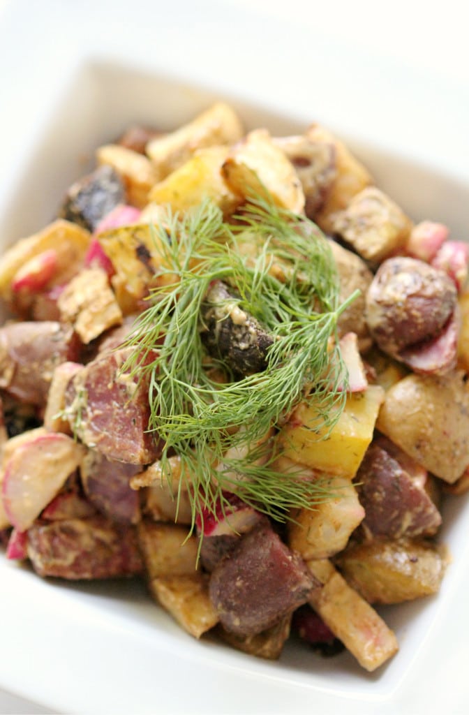 Potato salad topped with dill. 