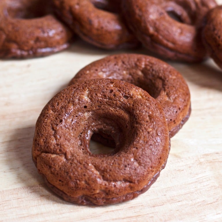 Multiple chunky money donuts on a serving board.