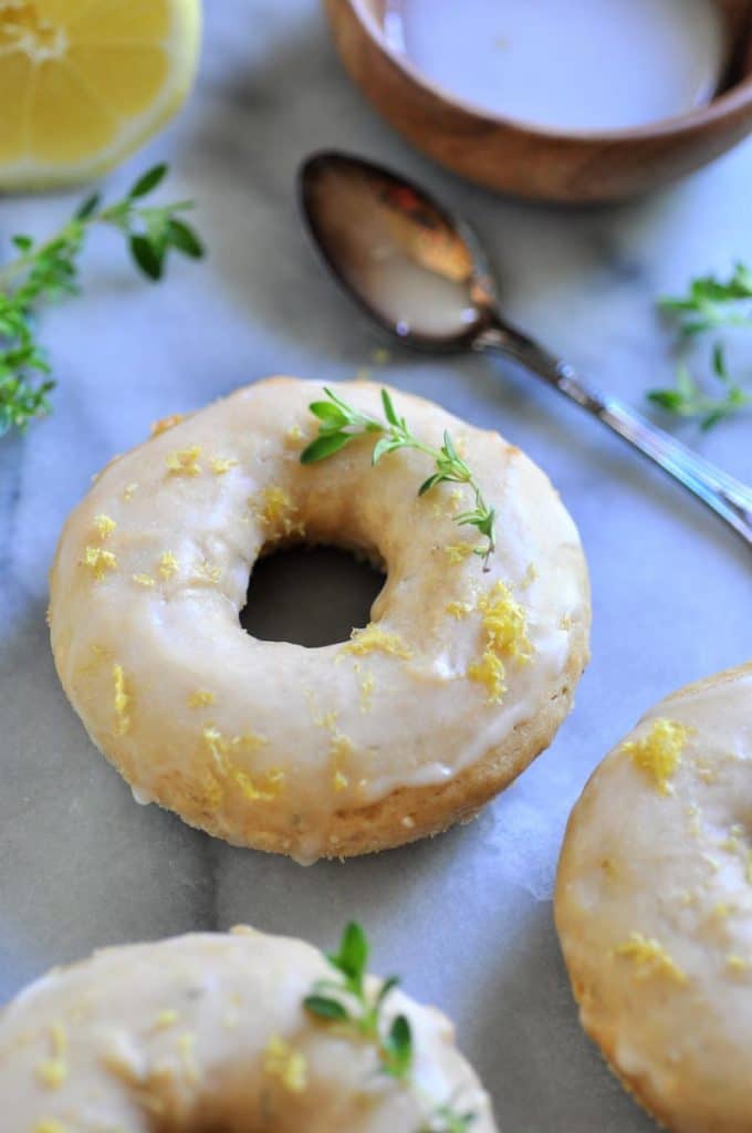 A vegan baked lemon and thyme donut.