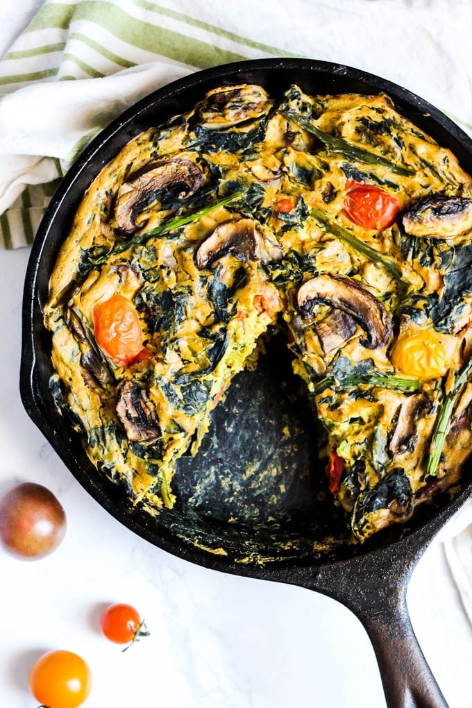 Asparagus and mushroom quich in a black cast iron skillet.  