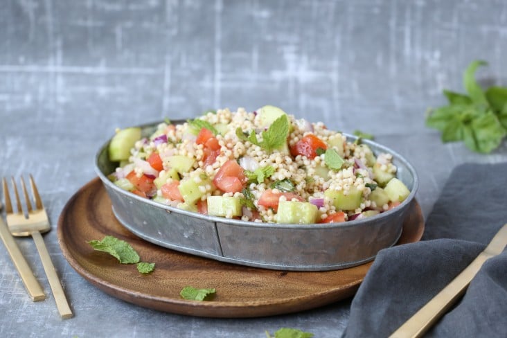 Israeli style sorghum salad with tomato and cucumber. 