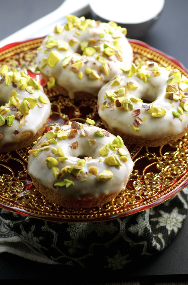 An angled photo of four vegan halvah donuts.