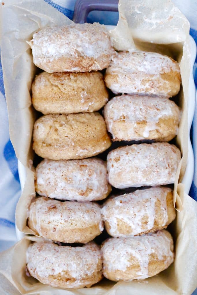 A close up of a tray of mini maple cinnamon pancake donuts.