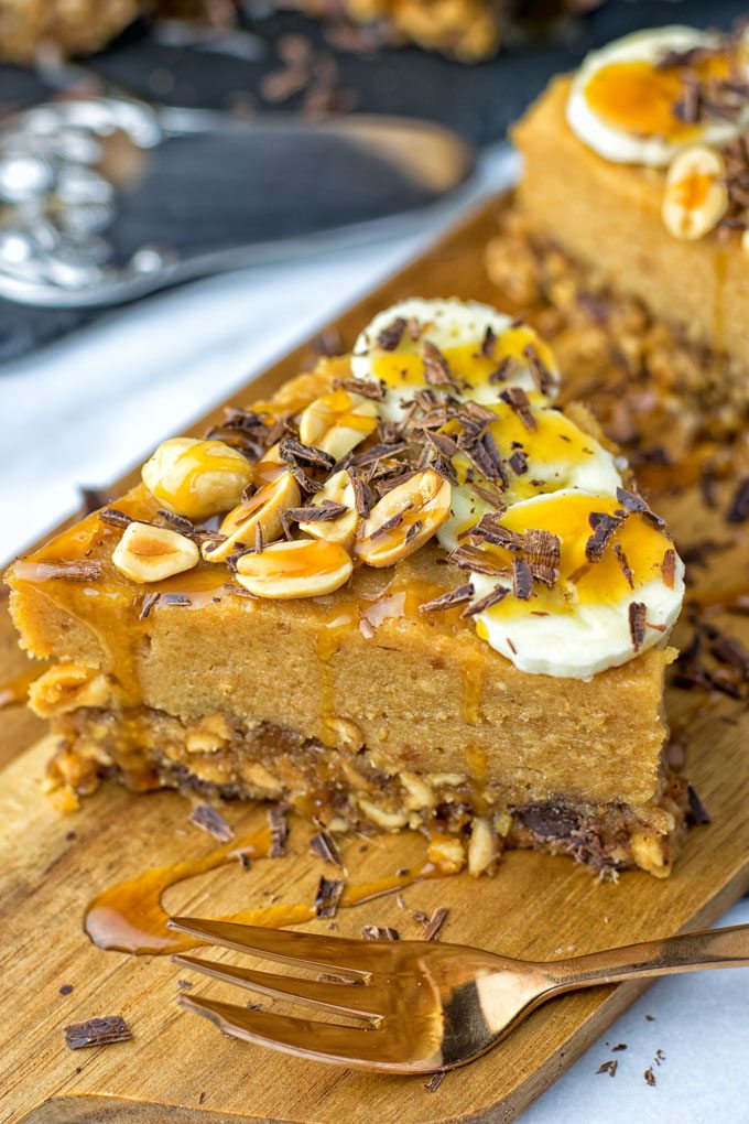 Banana cream pie slice on a wooden board.