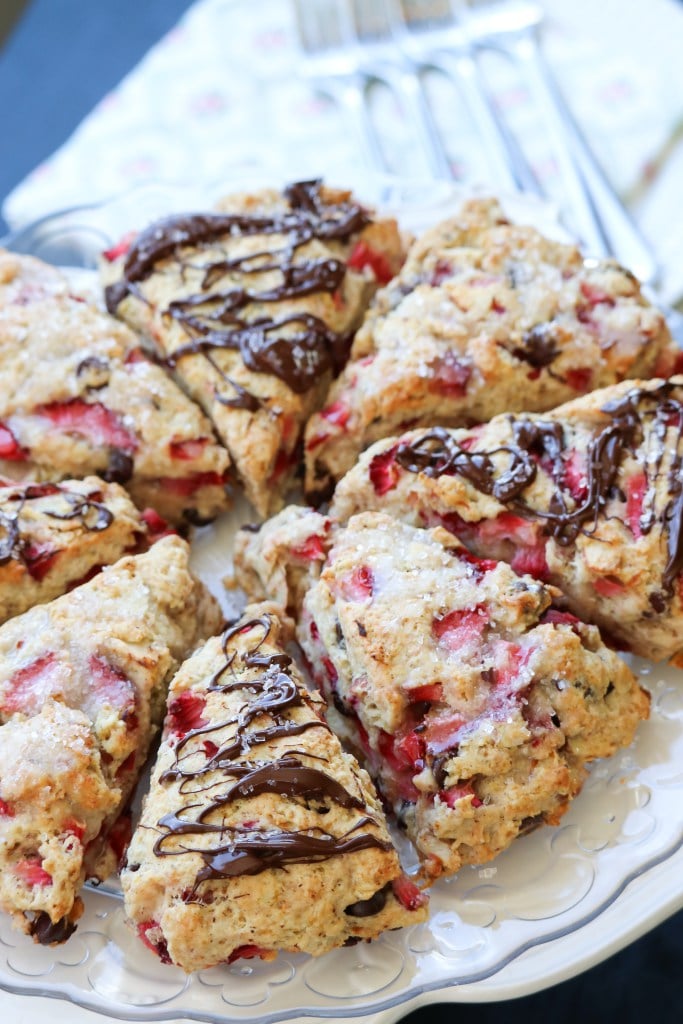 Chocolate strawberry scones on a clear dish. 