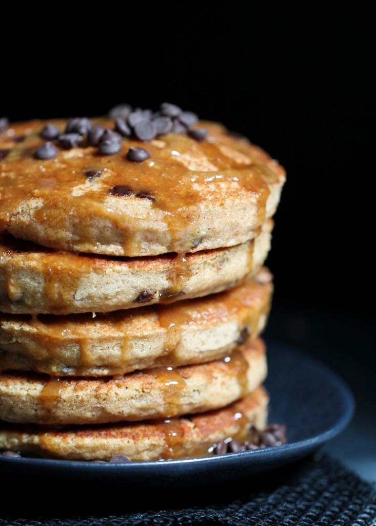 Peanut butter chocolate chip pancakes on a grey plate. 