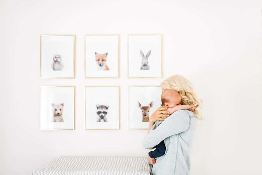 image of abbey holding baby E in a toddler's bedroom