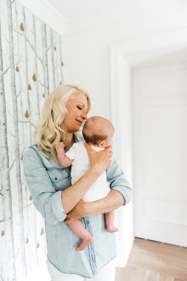 Women holding her baby.