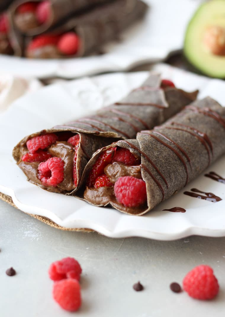 Buckwheat crepes with chocolate avocado mousse with strawberries and raspberries. 