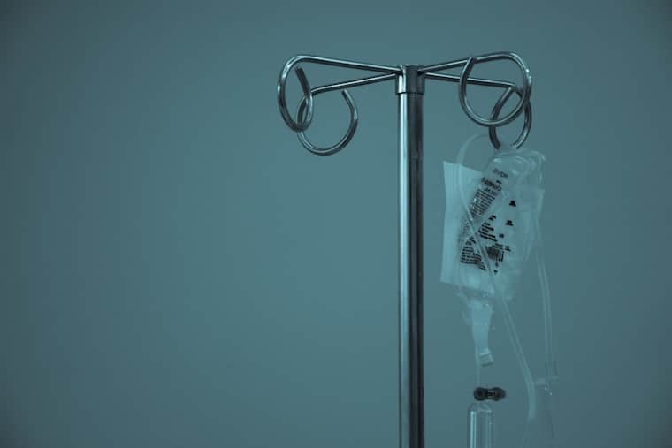 An IV bag, hanging.