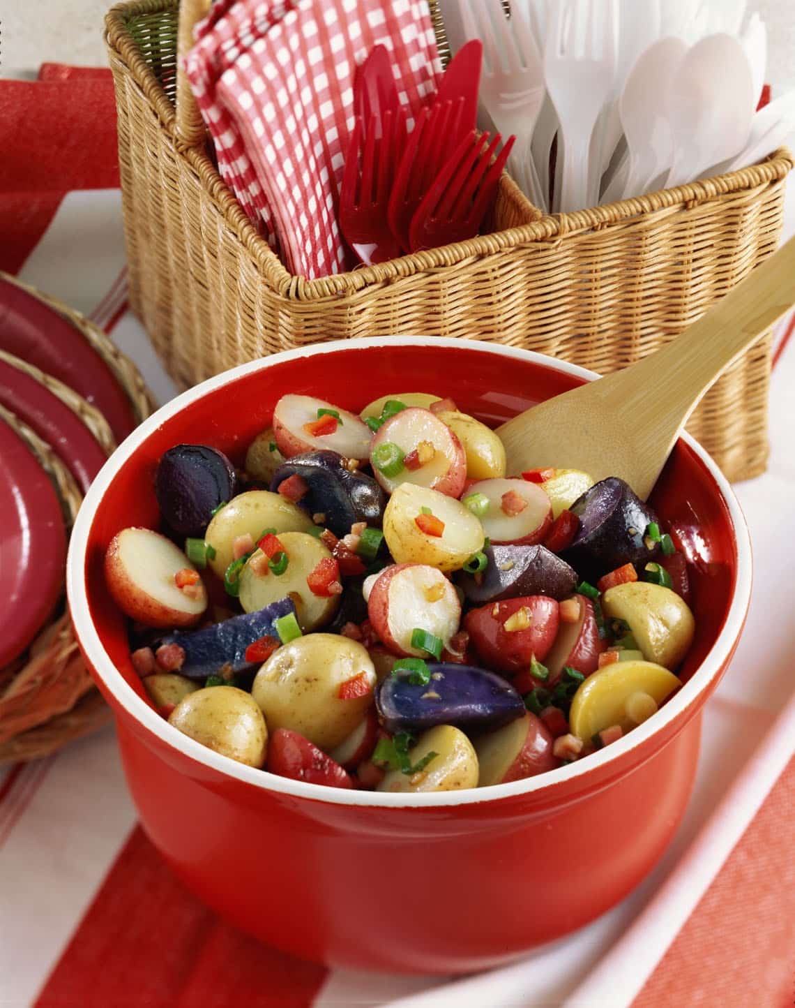 gluten free red white and blue potato salad in a red dish